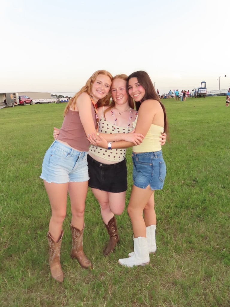 Three girls hugging
