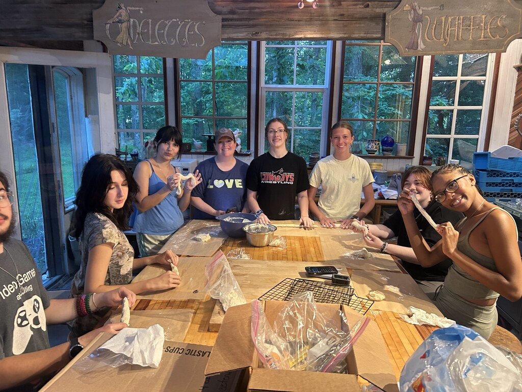 A group of students making homemade prezels.