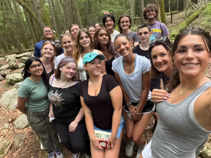 A group of students posing in the middle of their hike.