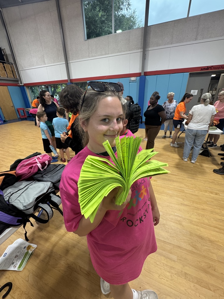 Kenzie holding papers