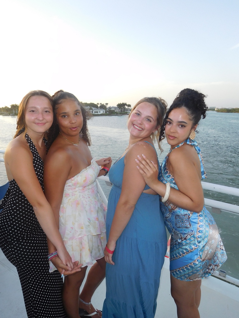 Four girls posing on a boat
