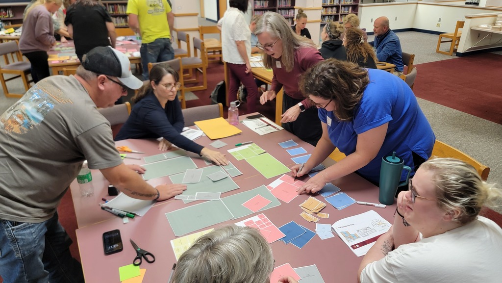 A group plotting different school layout options
