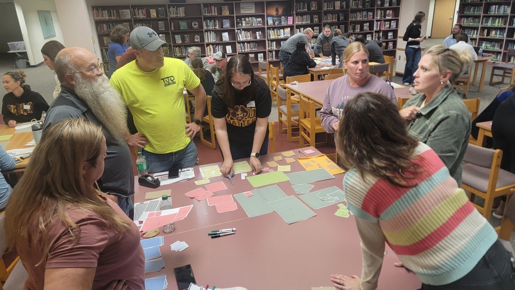 A group plotting different school layout options