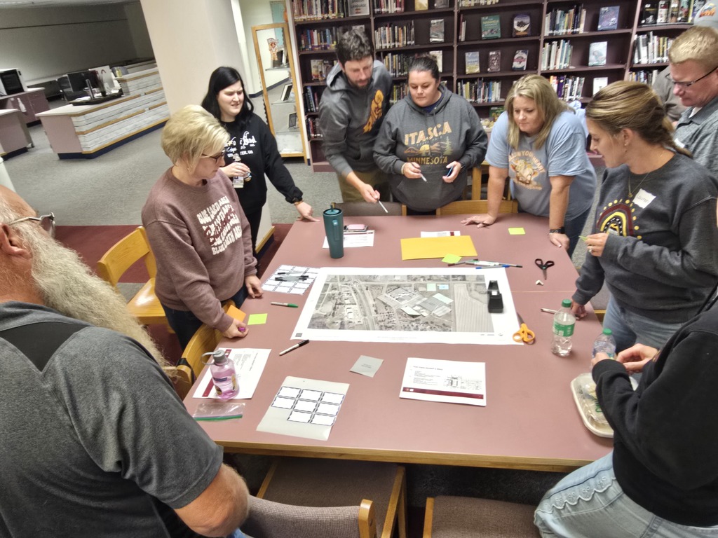 A group plotting different school layout options