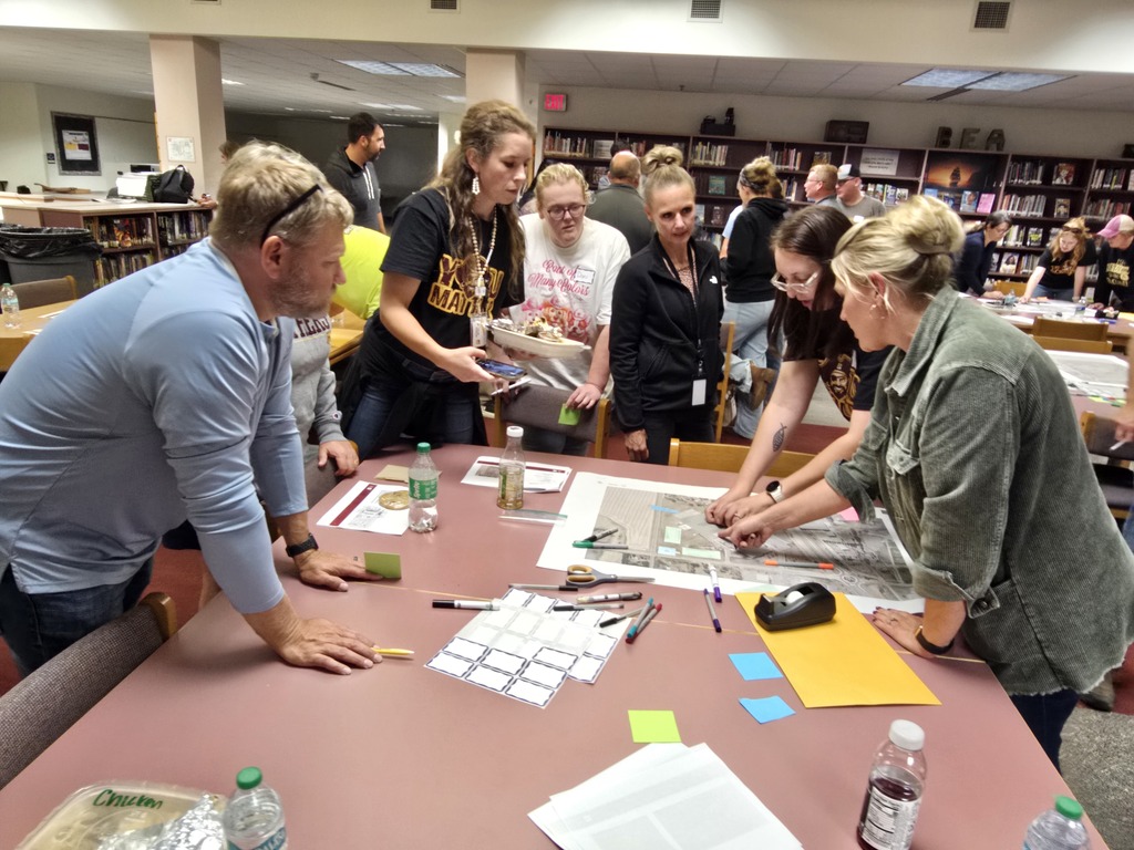 A group plotting different school layout options