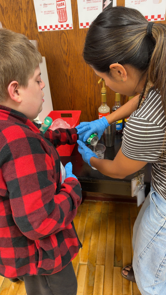 Student and teacher making coffee