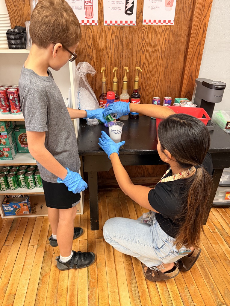 Student and teacher making coffee