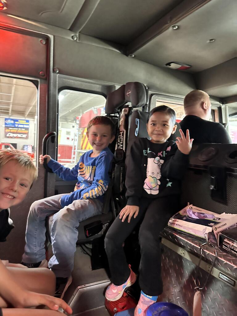 Kids riding in the fire truck
