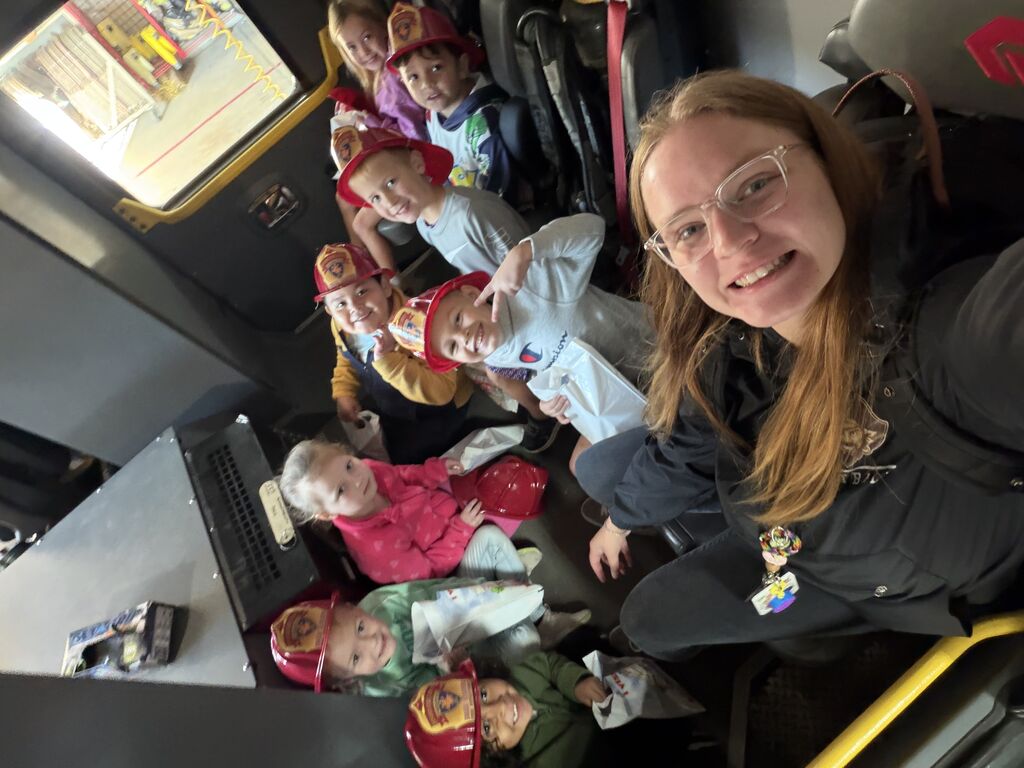 Kids riding in the fire truck