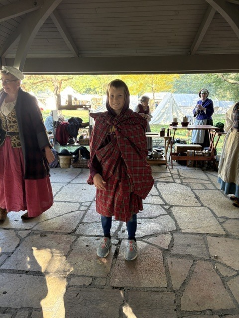 A student dressed in period clothing