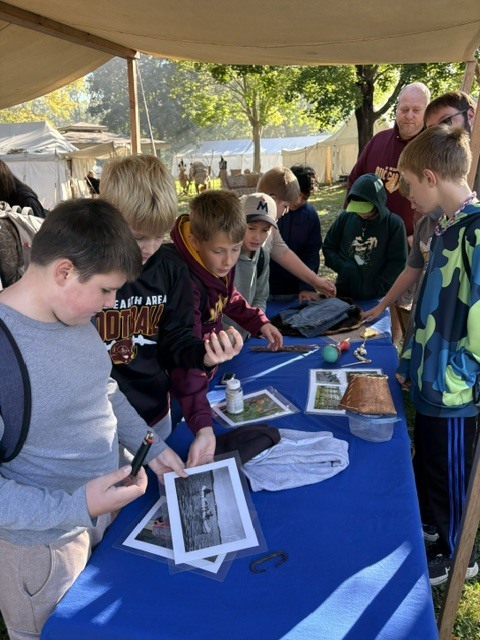 A group of students checking out old photos