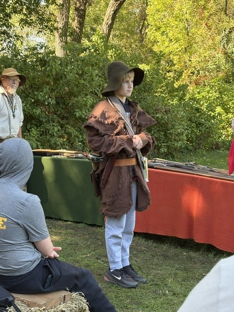 A student dressed in period clothing