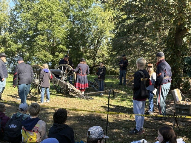 Student checking out the cannon