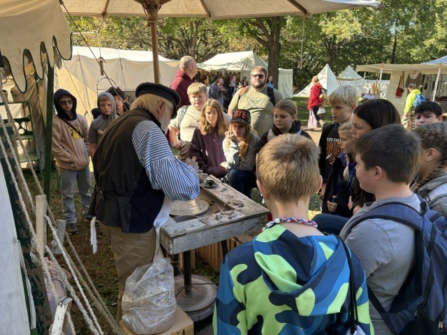 A group of students checking out one of the tents
