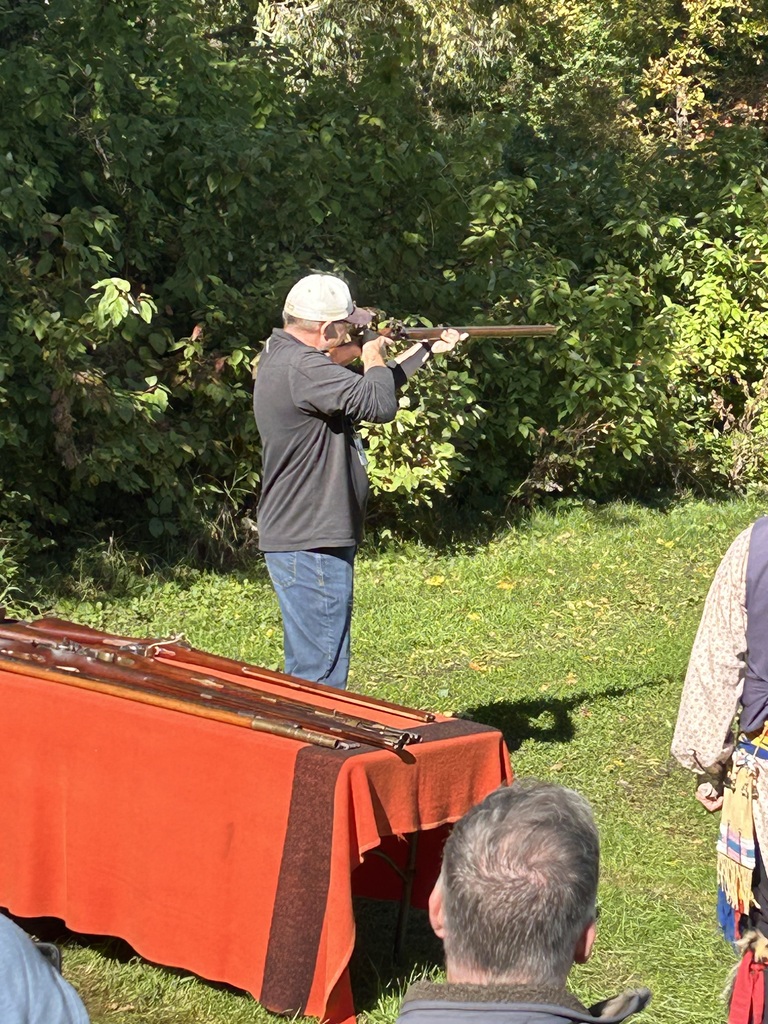 One of the BEA teachers shooting a gun during the event.