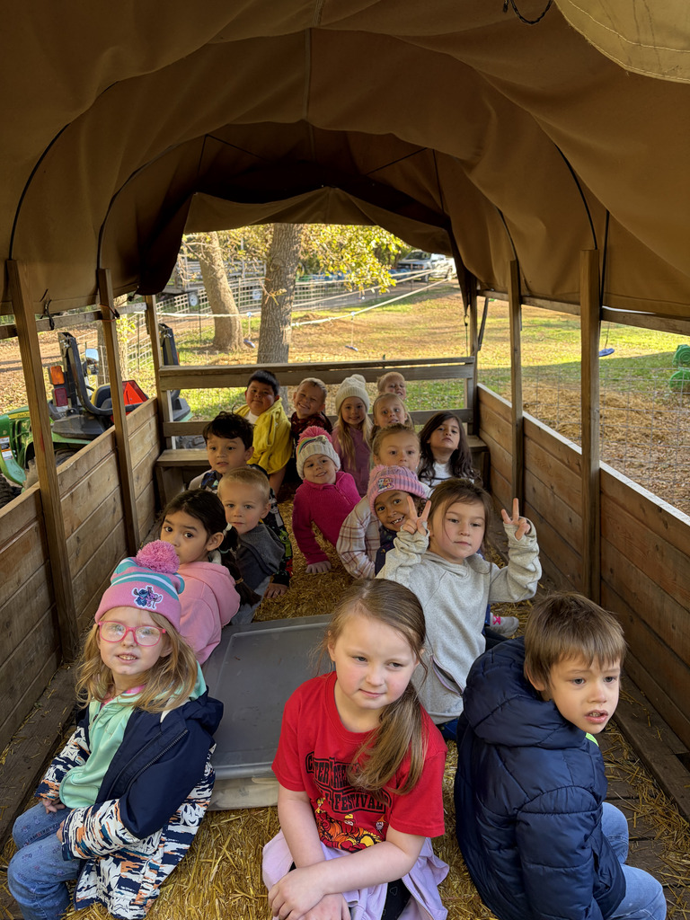 Students in a cover wagon