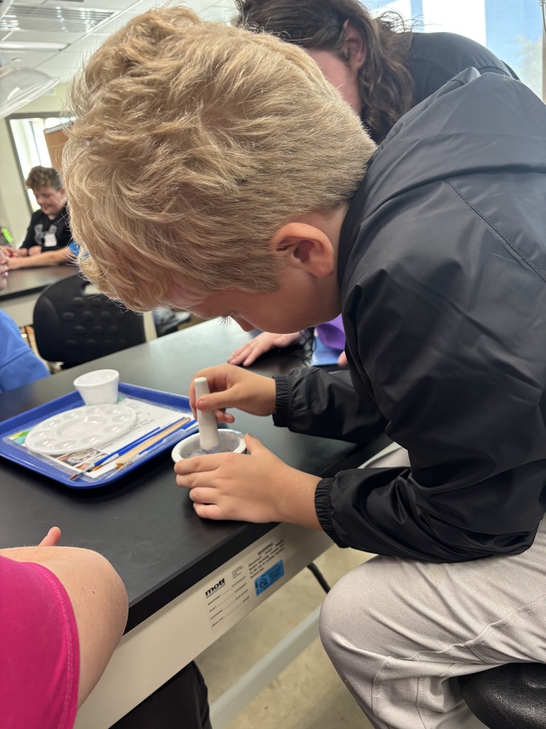 A student mixing something