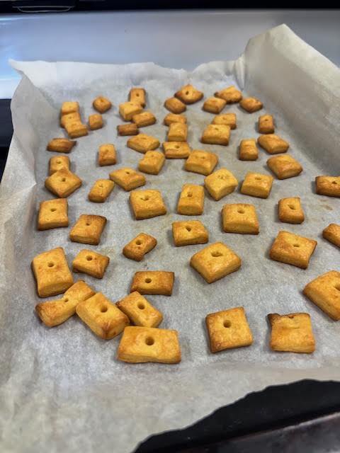 A baking sheet with homemade cheez its