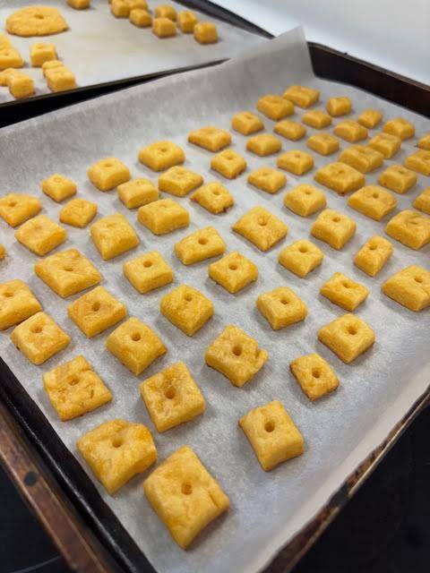 A baking sheet with homemade cheez its