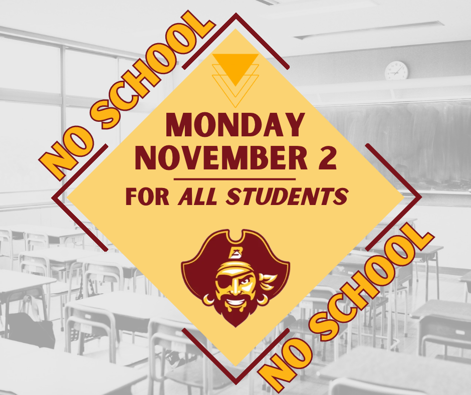 Notice of no school on Monday, November 2, for all students. Yellow sign with logo and text on a classroom background.