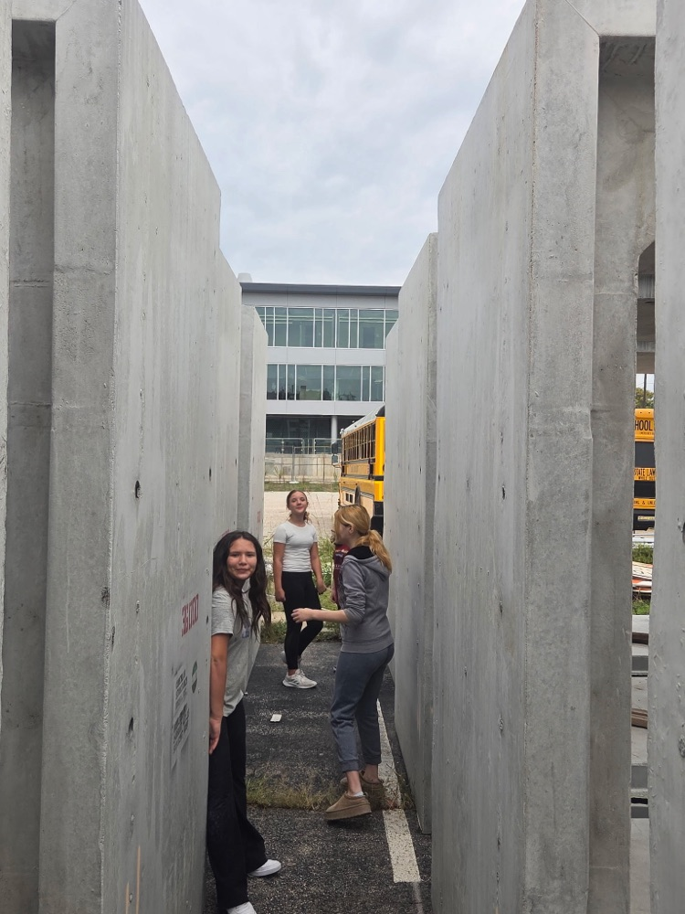 students walking on construction site.