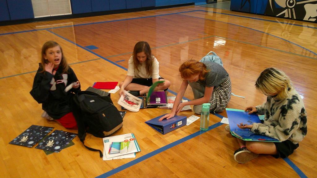 Students put binders together