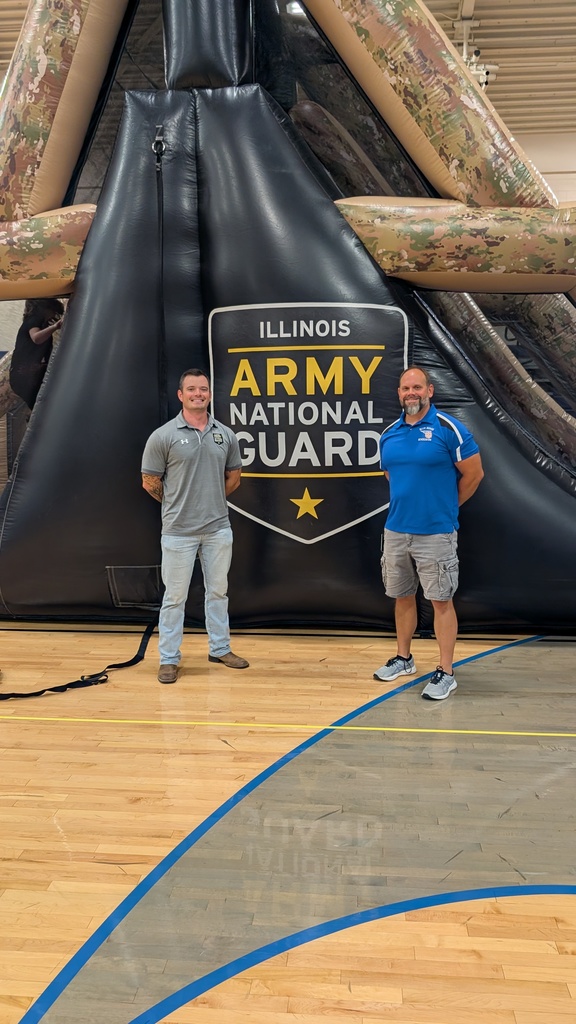 Mr. Miles and Mr. Fourdyce in front of the obstacle course 