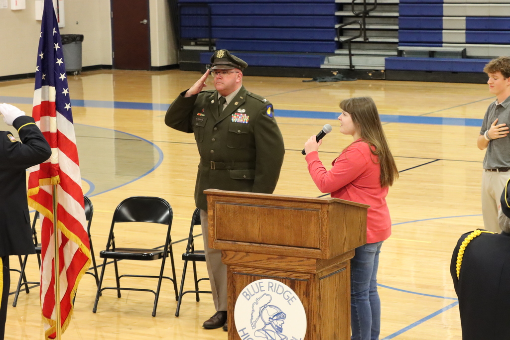 Senior Lauren Graning singing the National Anthem 