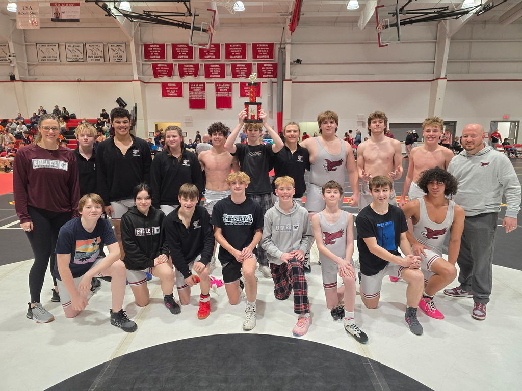 The wrestling team with their trophy