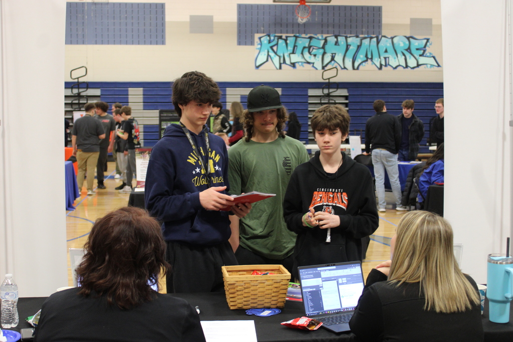 Students speaking with representatives of different technical careers