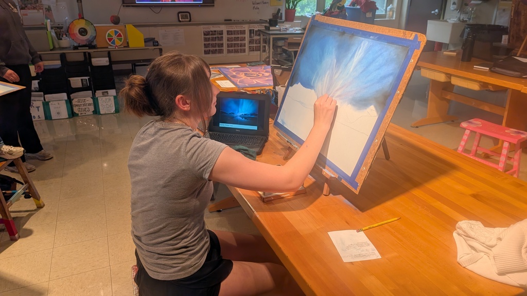 Working on a landscape on an easel