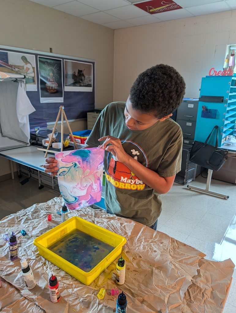 Art Club making water marbled paper.