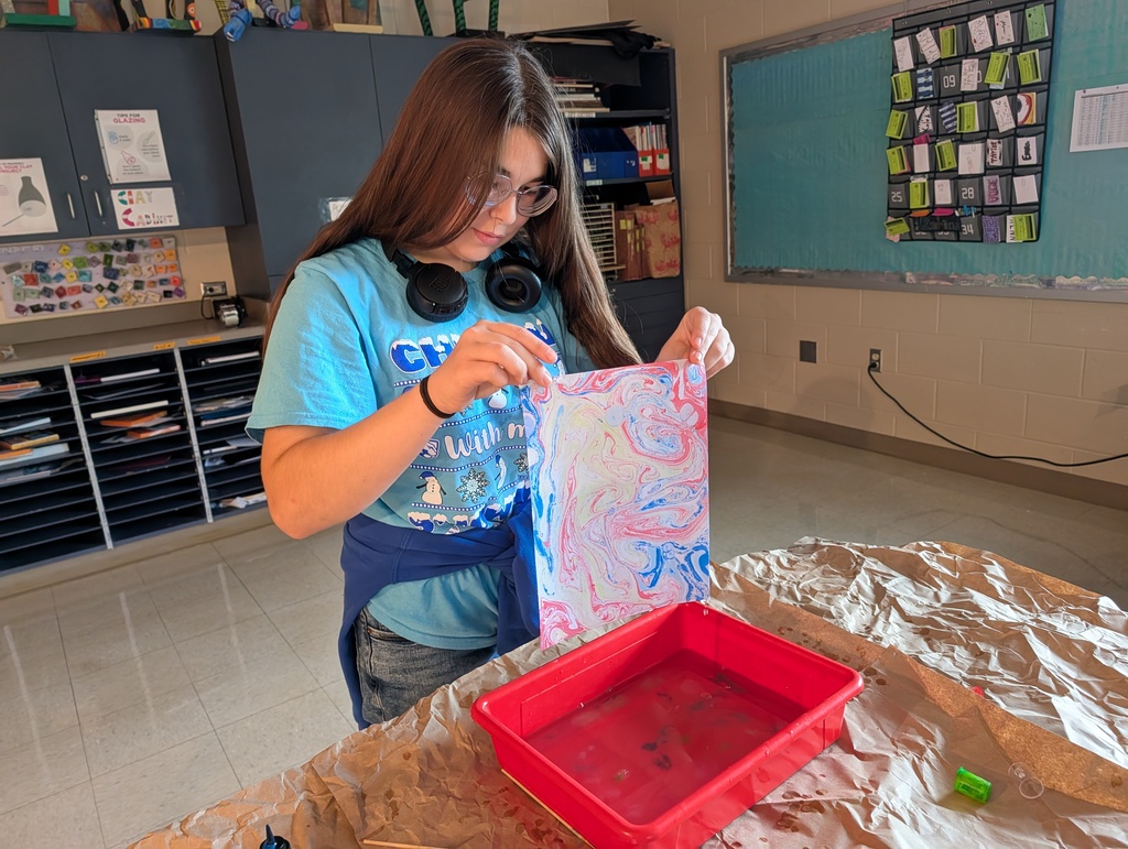 Art Club making water marbled paper.