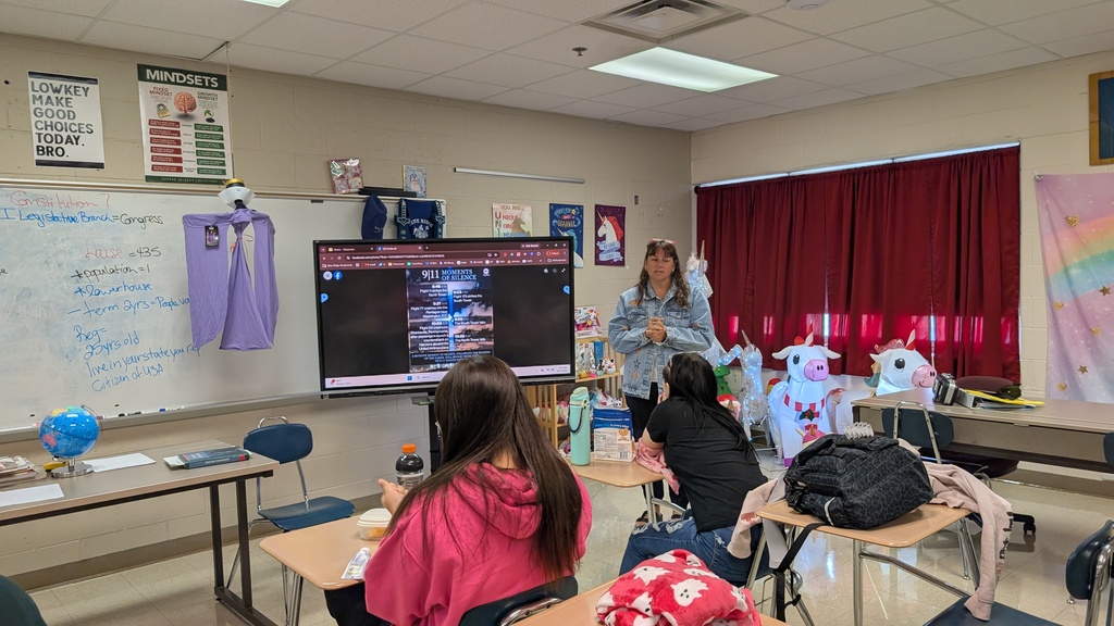 Mrs. Flannell going through the timeline of events of 9/11/2001