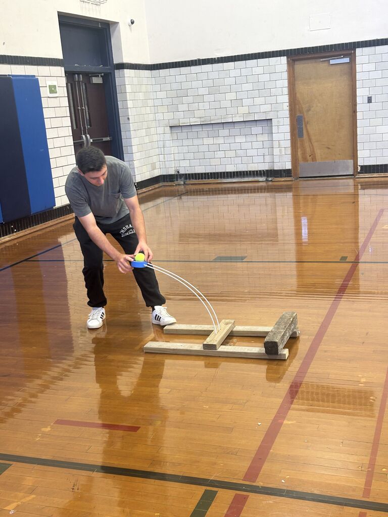 Elijah Beadle testing his catapult.