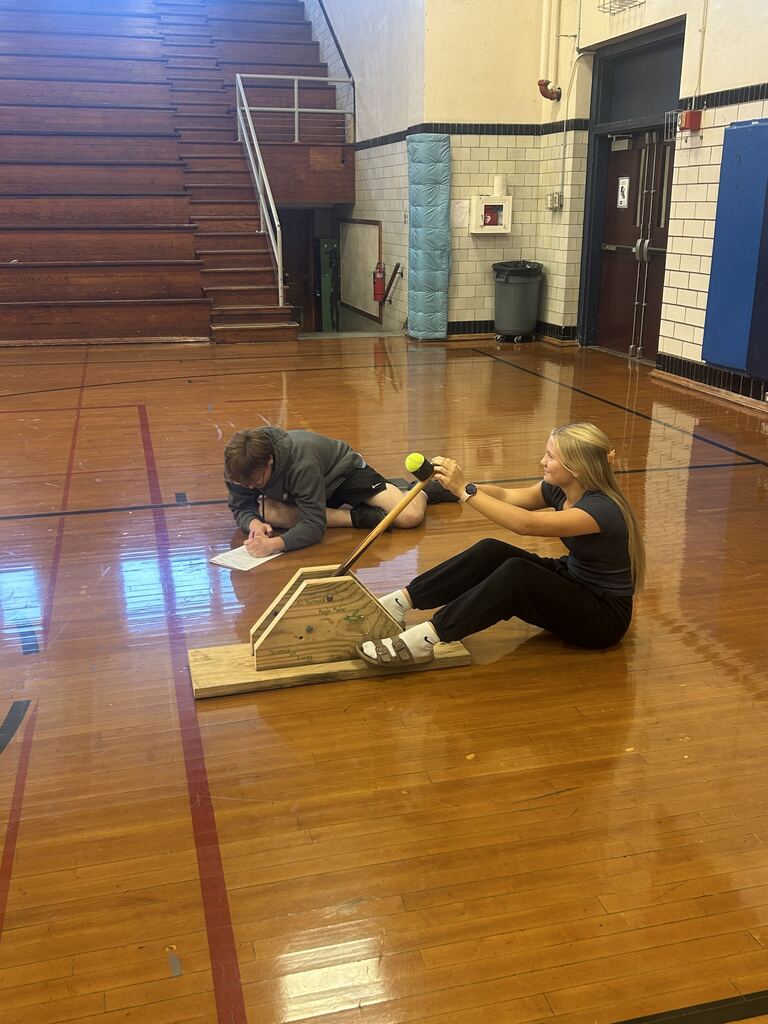 AJ Bernard and Kayla Meeker testing their catapult. 