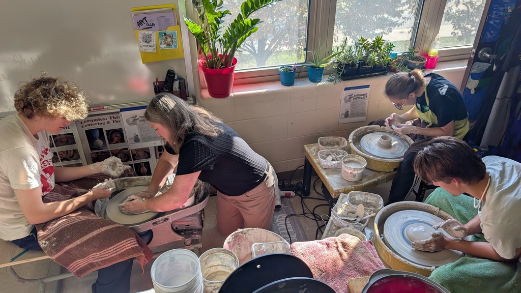 Art 3 working on the pottery wheels