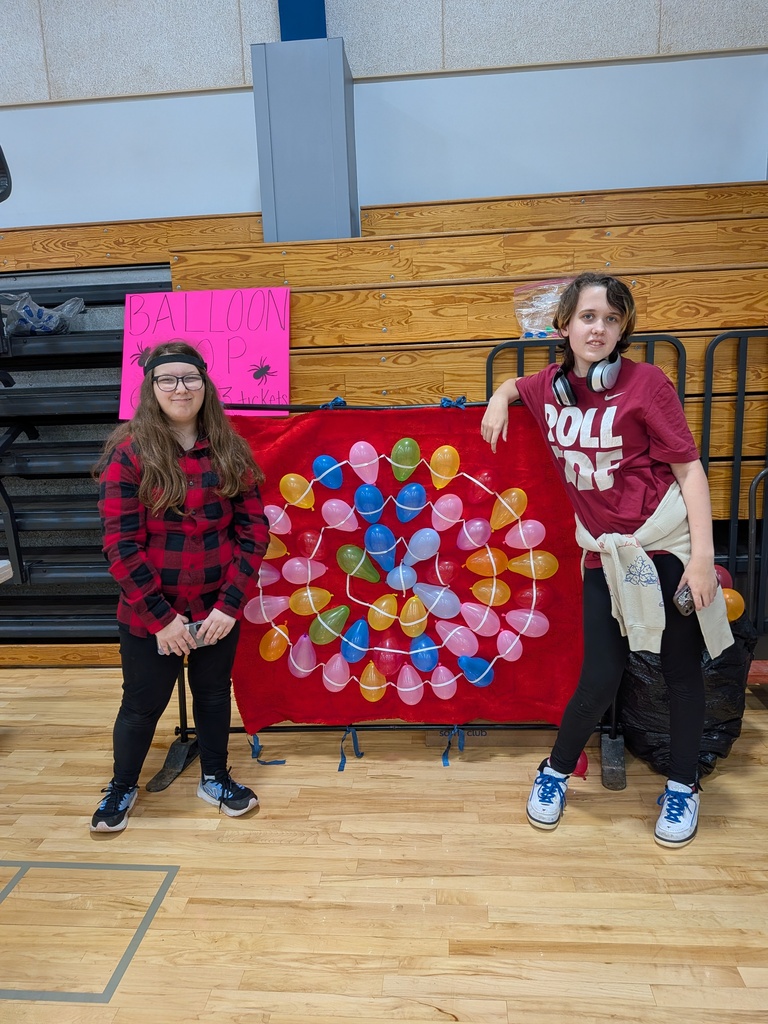 Anna and Sky are all set with the dart throw game