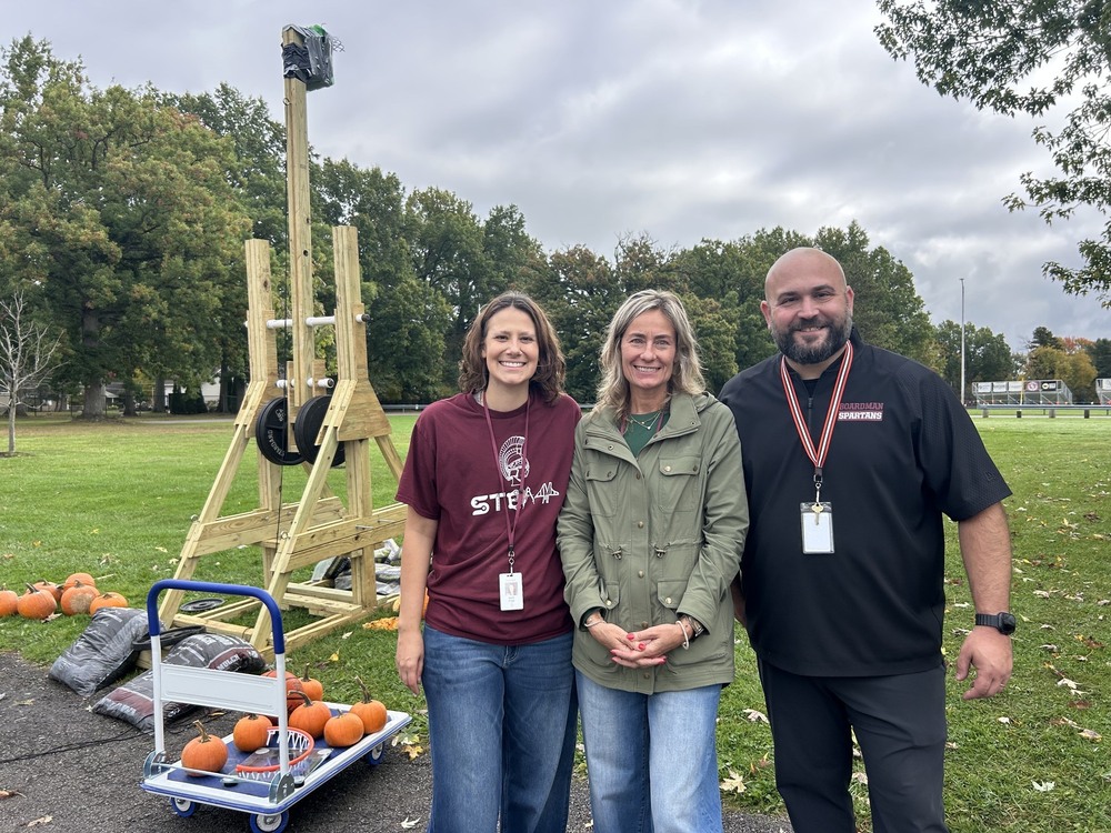 a giant trebuchet with BGJHS 8th grade science teachers Mrs. Frost, Mrs. Metzel, Mr. Geffert