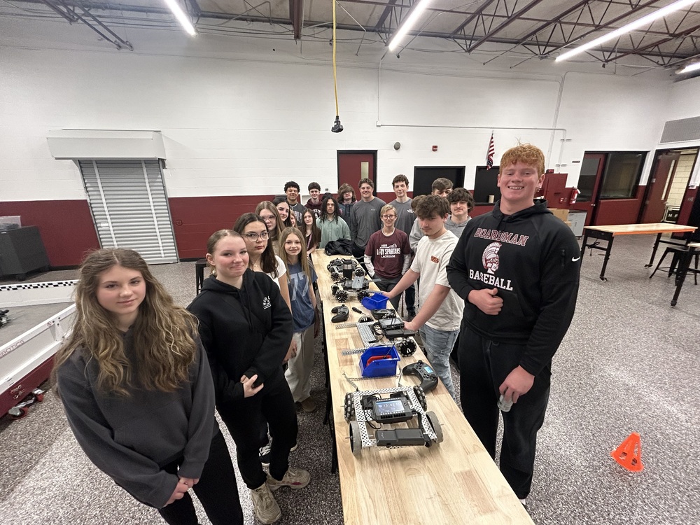 8th grade and high school students with robotics in STEAM Lab
