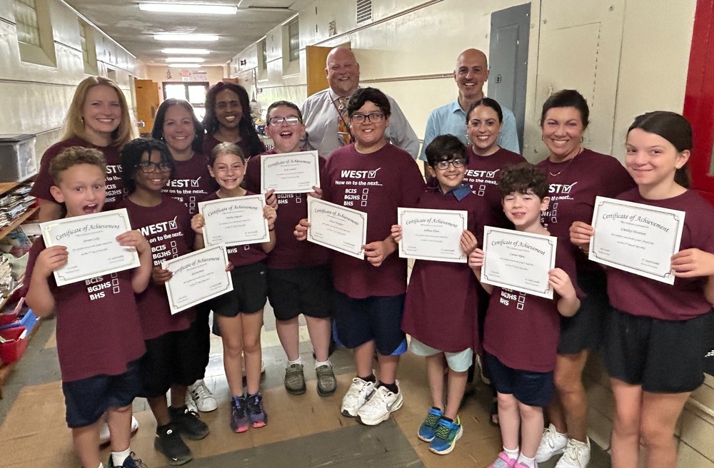 8 students holding perfect score certificates with their teachers, Superintendent Niefer and Mr. Cardillo