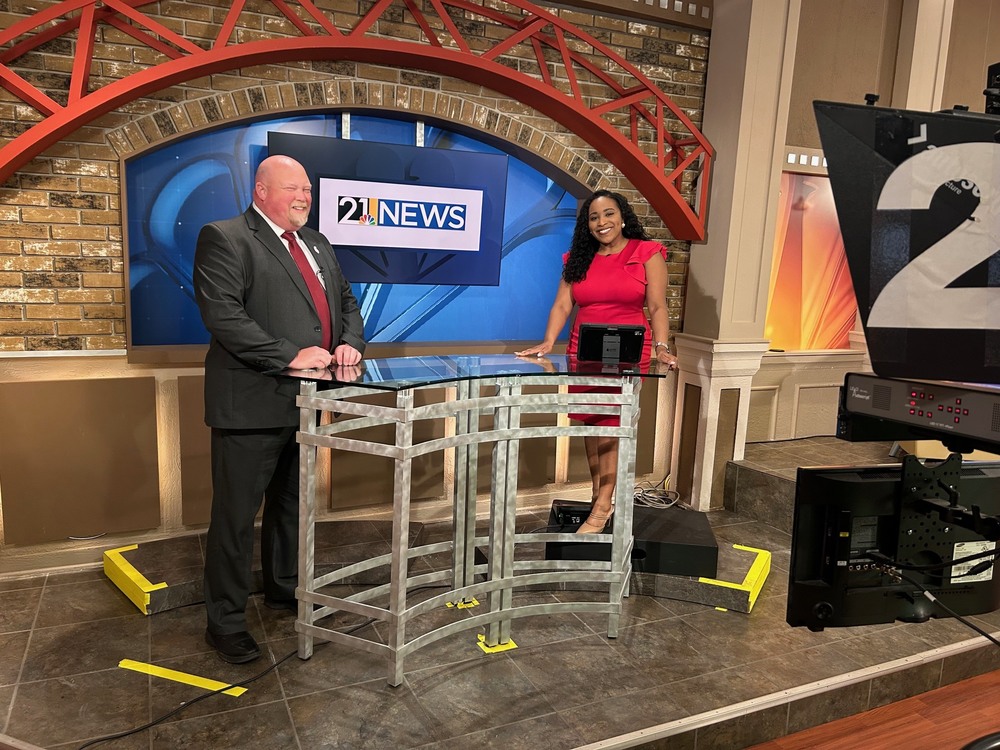 Superintendent Chris Neifer with Malaynia Spiva on set of WFMJ TV 21