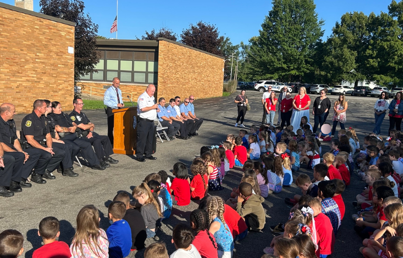 Stadium Drive Elementary Students at 9/11 Ceremony with first responders and Principal Zoccali speaking to them