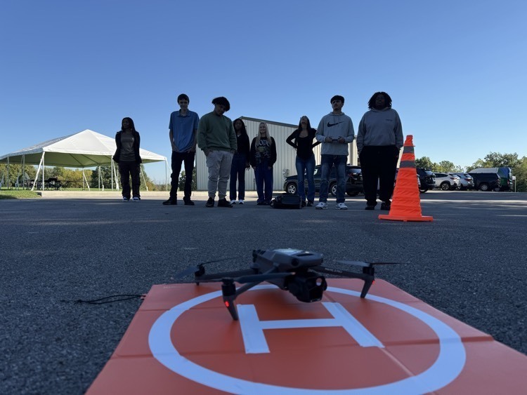 Boardman students outside with a drone on a landing pad