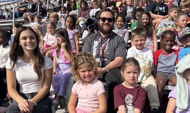 Teachers and students in the stands for the elementary band show at Spartan Stadium