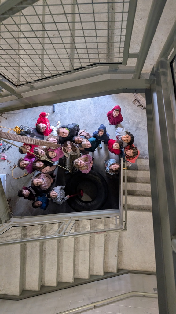 students at the bottom of the training stairs