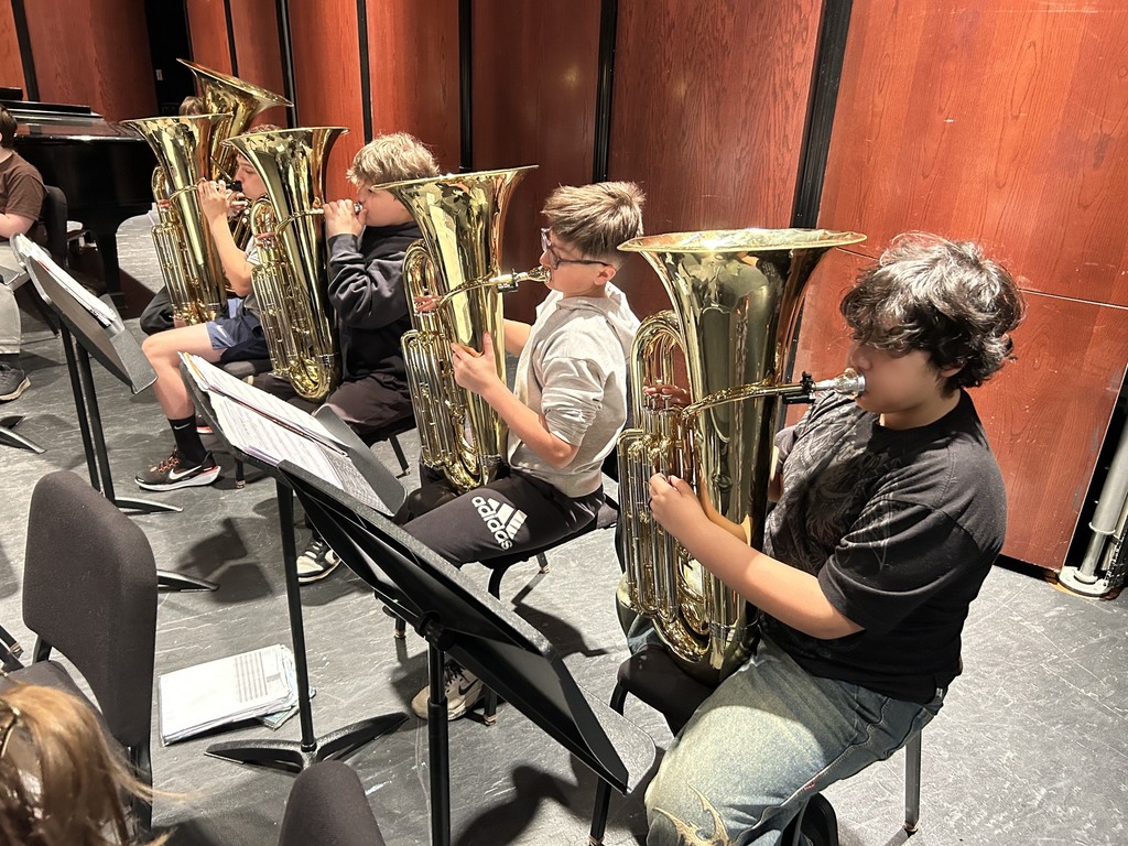 students playing tubas