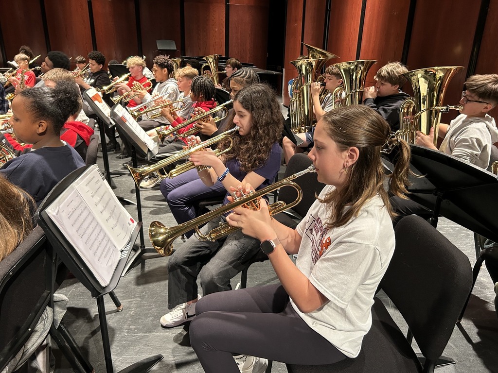 girls playing trumpets