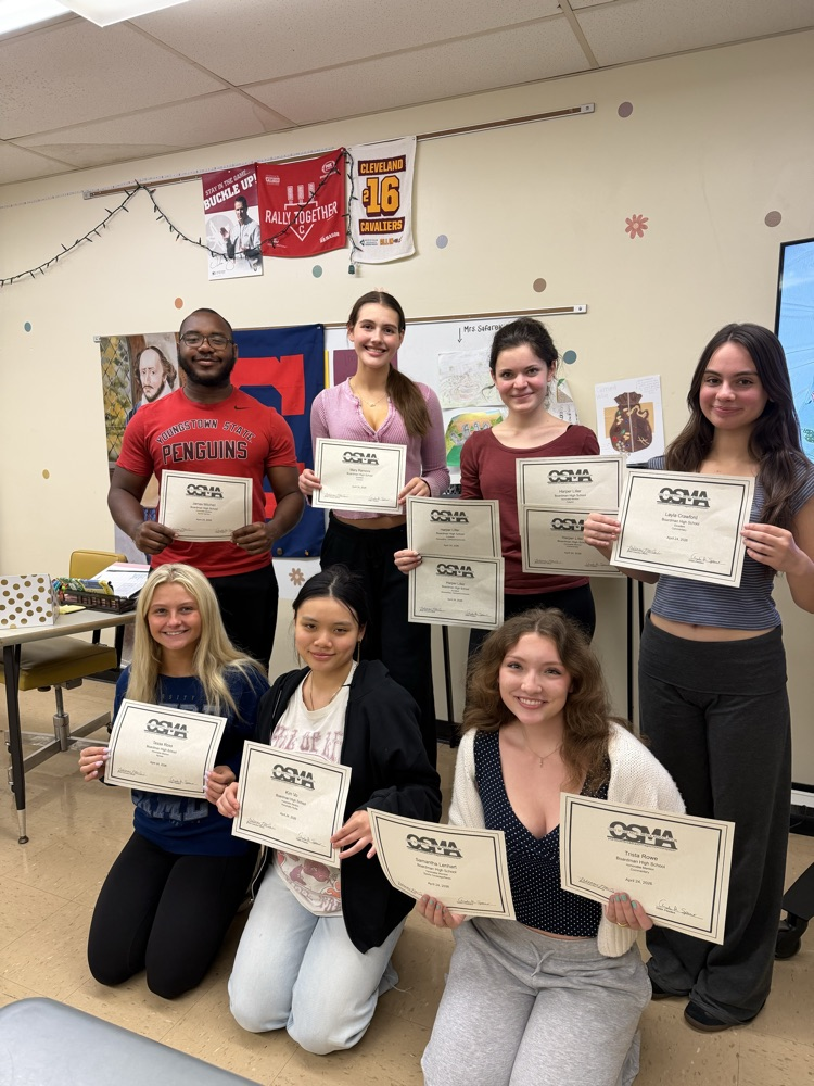 7 Bugle Staff members holding certificates from Scholastics Journalism competition 