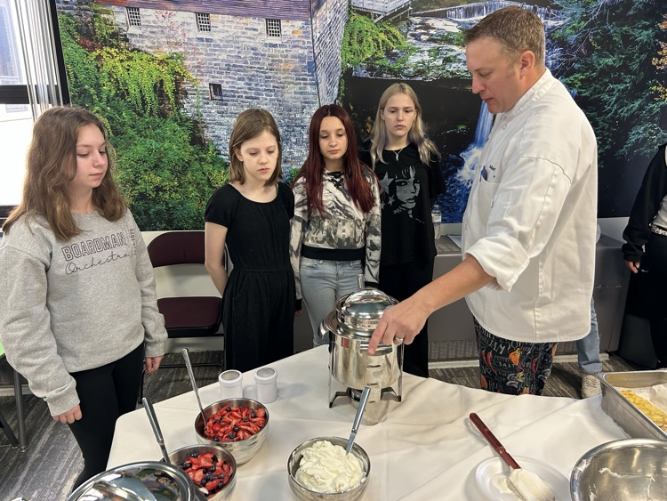 students learning to make crepes
